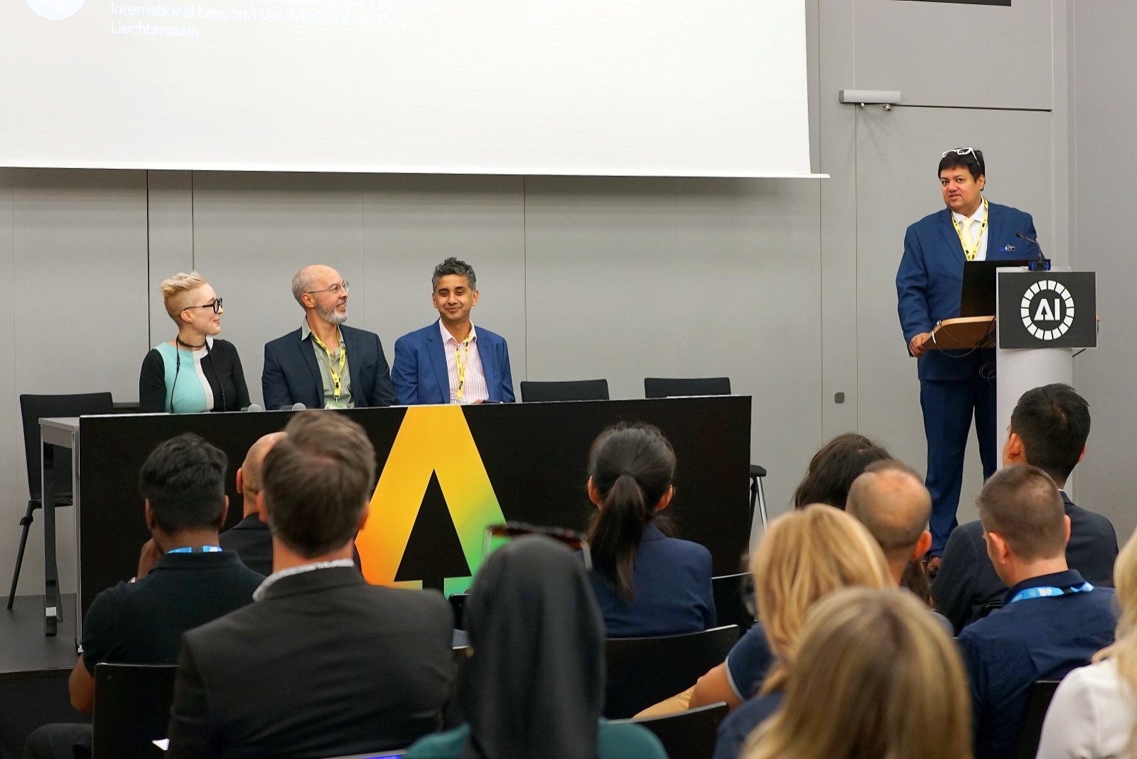 The Strategy and Frameworks panel at the AI for Good Summit, seated at a table before an audience