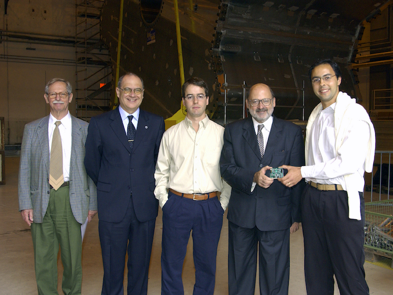 André Anjos with the Brazilian ministerial delegation in the ATLAS assembly hall at CERN, July 2002