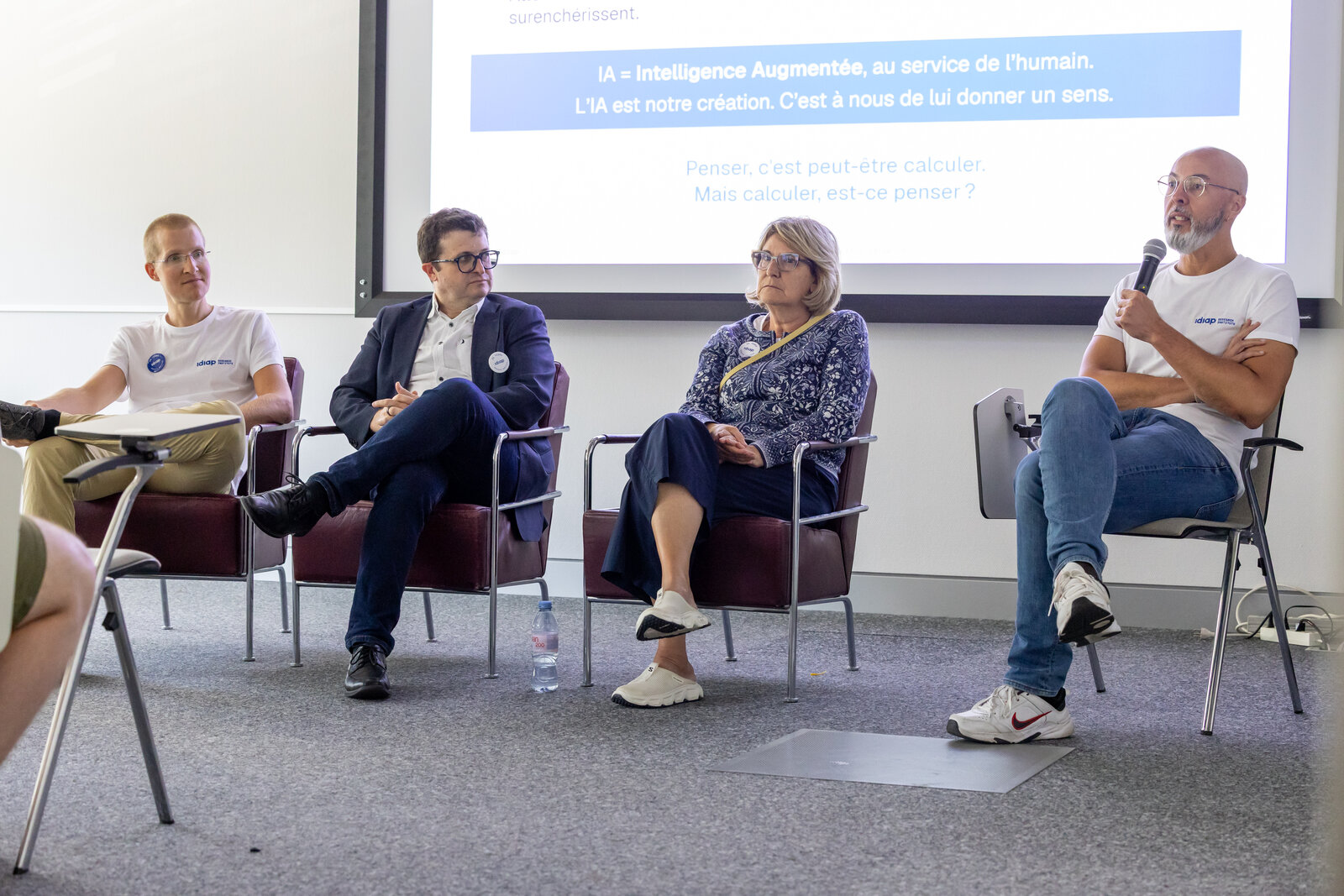 Four speakers taking part in a panel discussion at Idiap