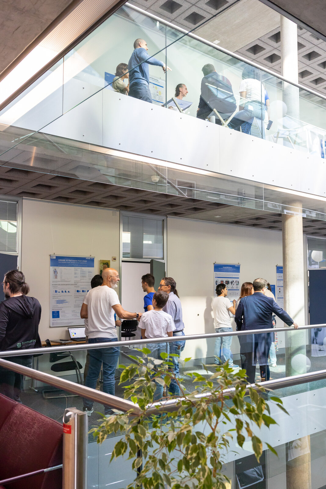 Visitors exploring demonstrations on the Idiap balconies