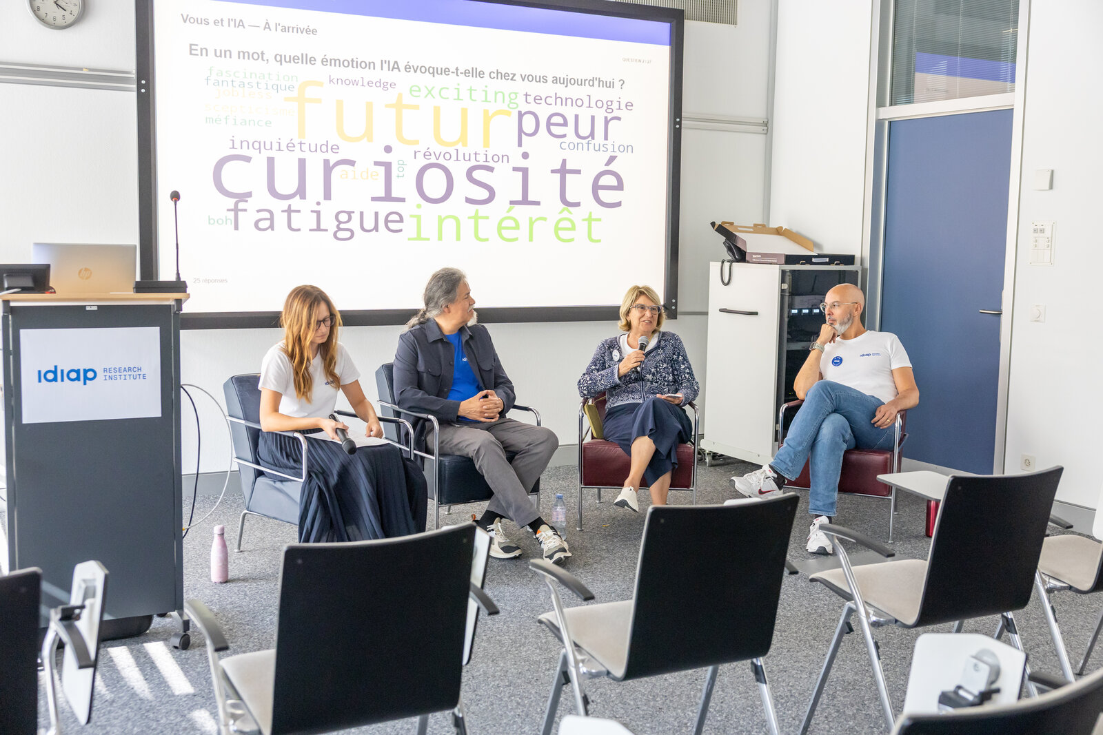 The panel and presentation screen at the Open Day