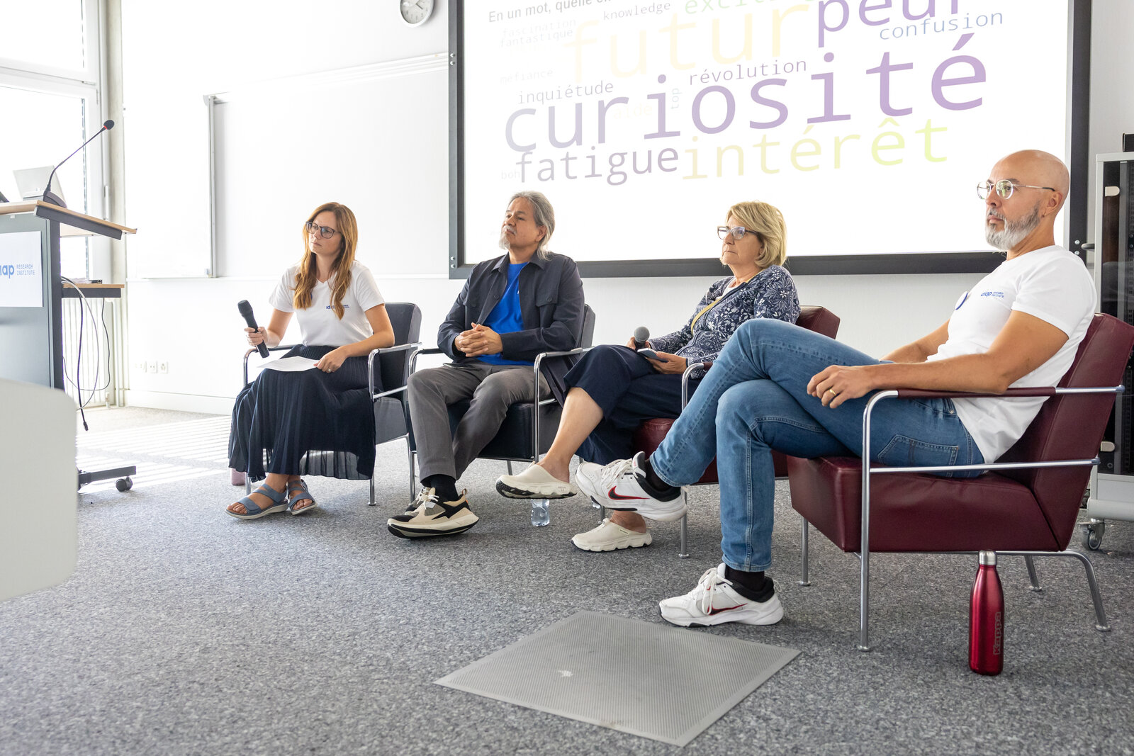 The four panel speakers seated at the front of the room