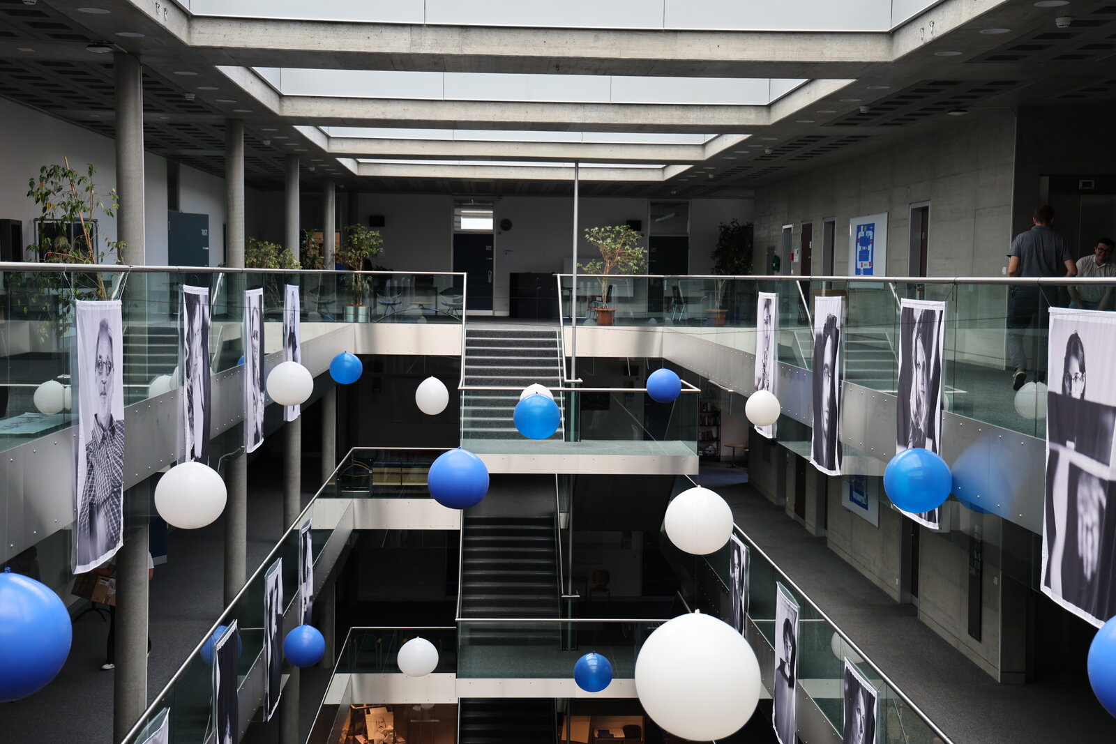 Balloons and portrait banners in the Idiap atrium